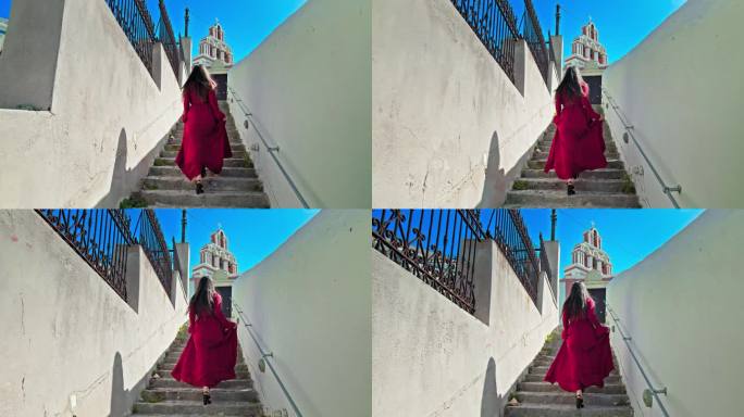 一位身穿红色连衣裙的美丽女孩走在著名的欧洲旅游景点圆顶教堂的楼梯上。