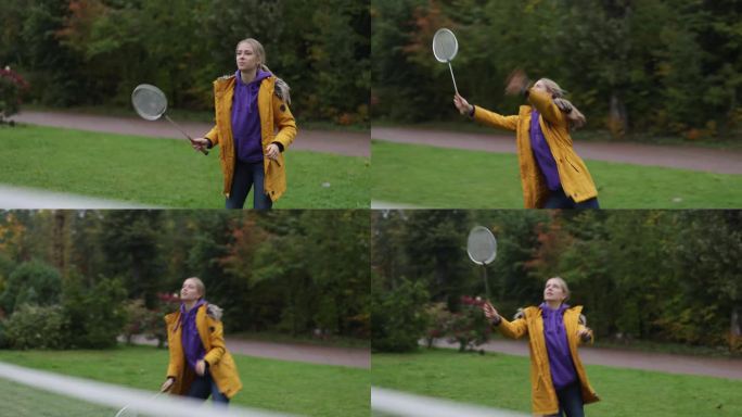 十几岁的女孩在后院打羽毛球