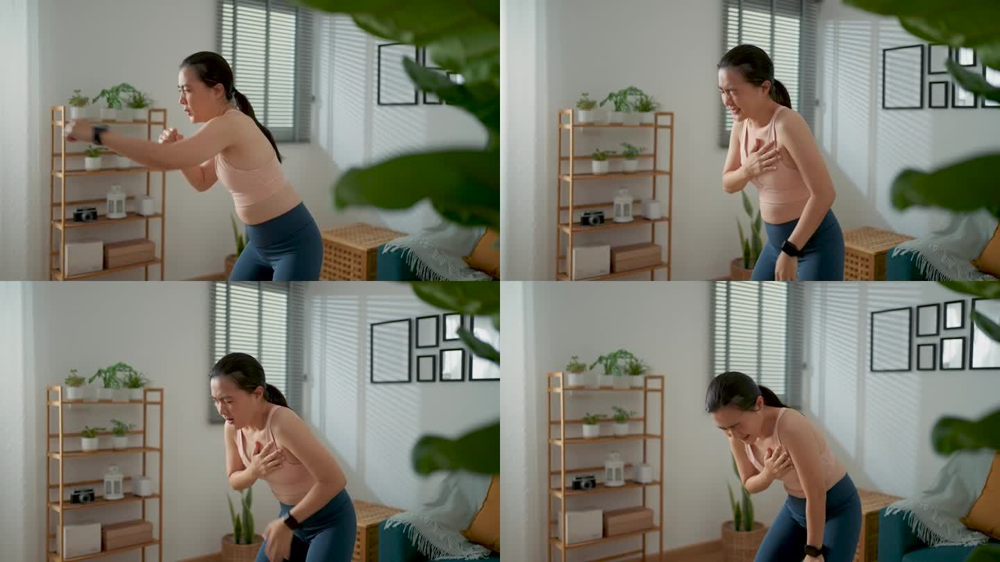 一名亚洲女性在家里客厅运动时胸口疼痛。