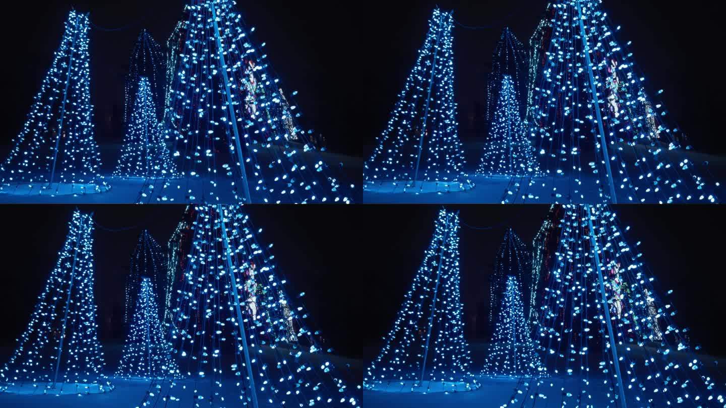 圣诞节的节日灯树雕塑在冬天的夜晚