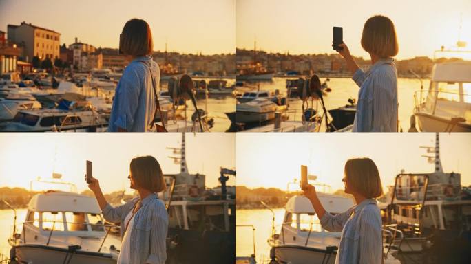 拍摄快乐:一名女子在日出时用手机拍摄古老的海滨小镇罗维尼