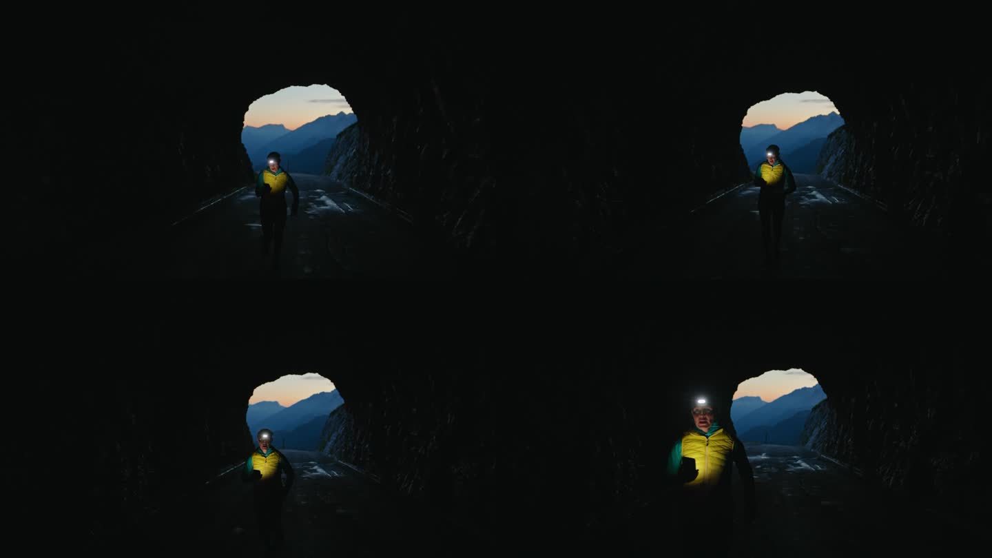 女子带着头灯在黑暗的山间隧道里慢跑