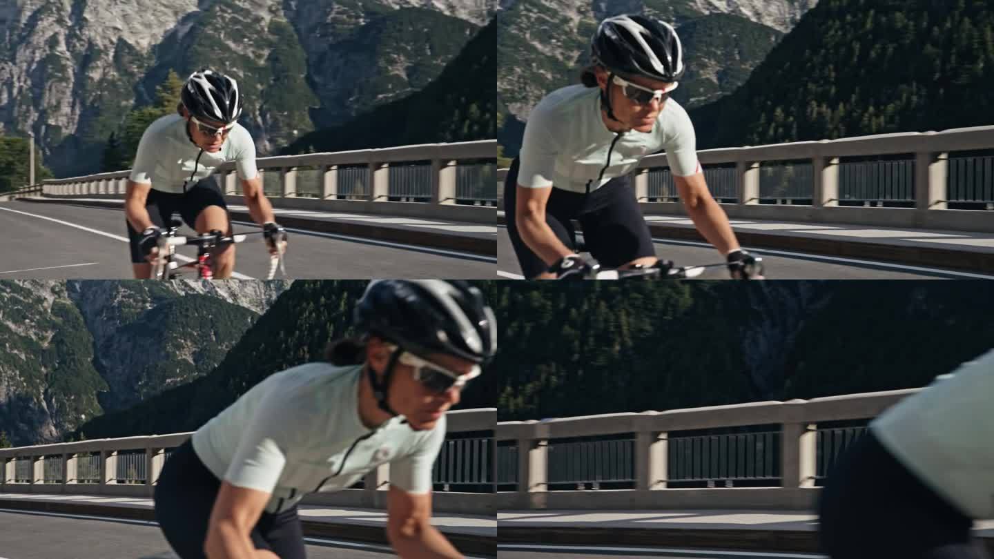 戴着头盔和太阳镜的女自行车手上坡