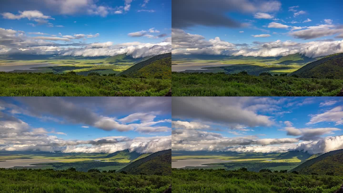 非洲坦桑尼亚，火山口，恩戈罗恩戈罗保护区，郁郁葱葱的绿色山坡上多云天空的时间变化