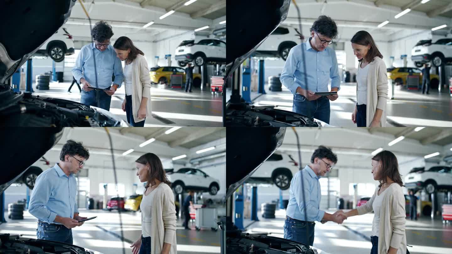 汽车修理店经理和顾客讨论汽车维修
