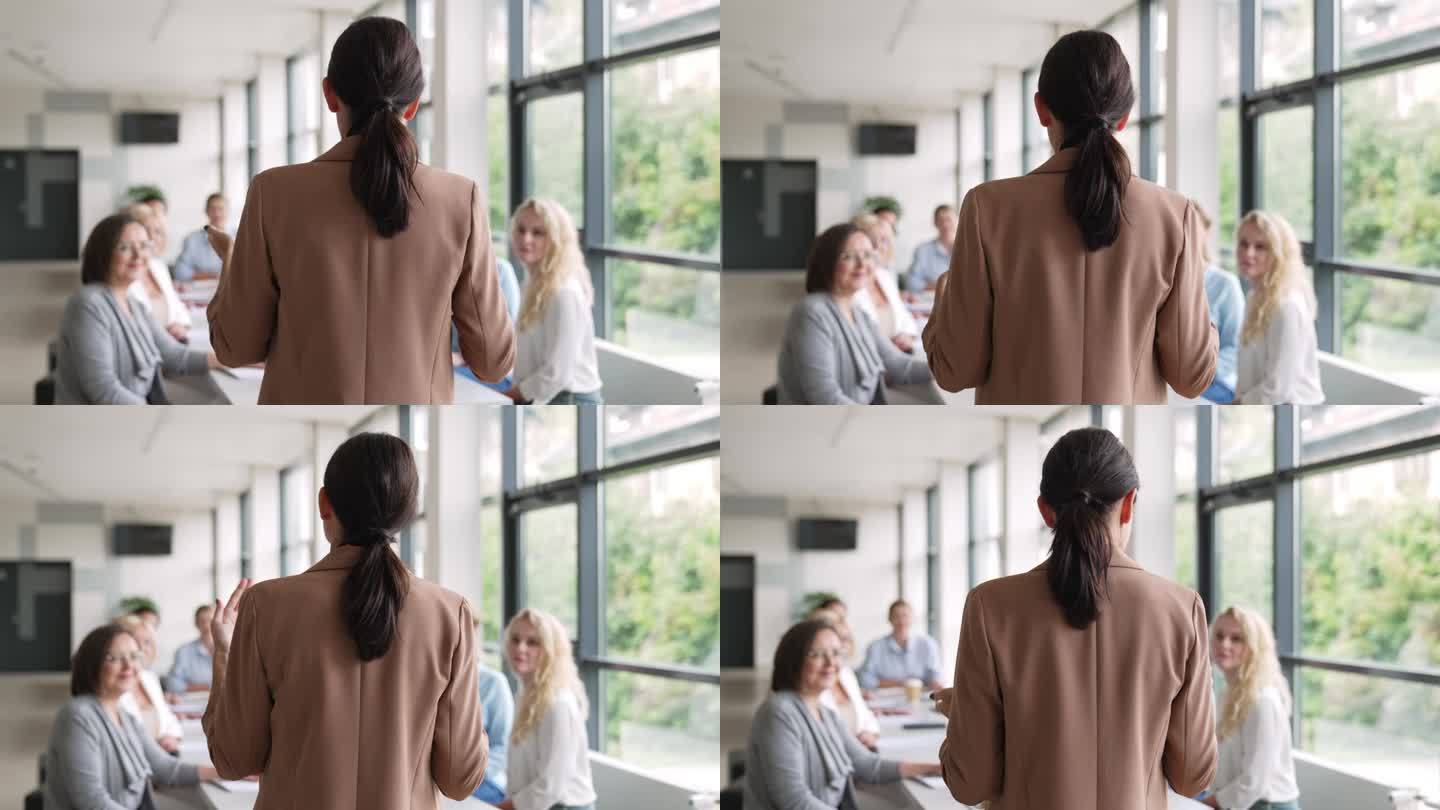 女企业家会议上女演讲者的背影