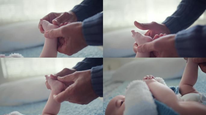 宝宝的脚，手和按摩腿与一个人在家里的爱，关心和支持在一起。床，脚和快乐的孩子在一个房子里，为新生儿护