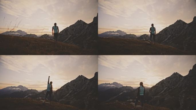 日出时，在风景秀丽的山岭上欢呼的女性慢跑者
