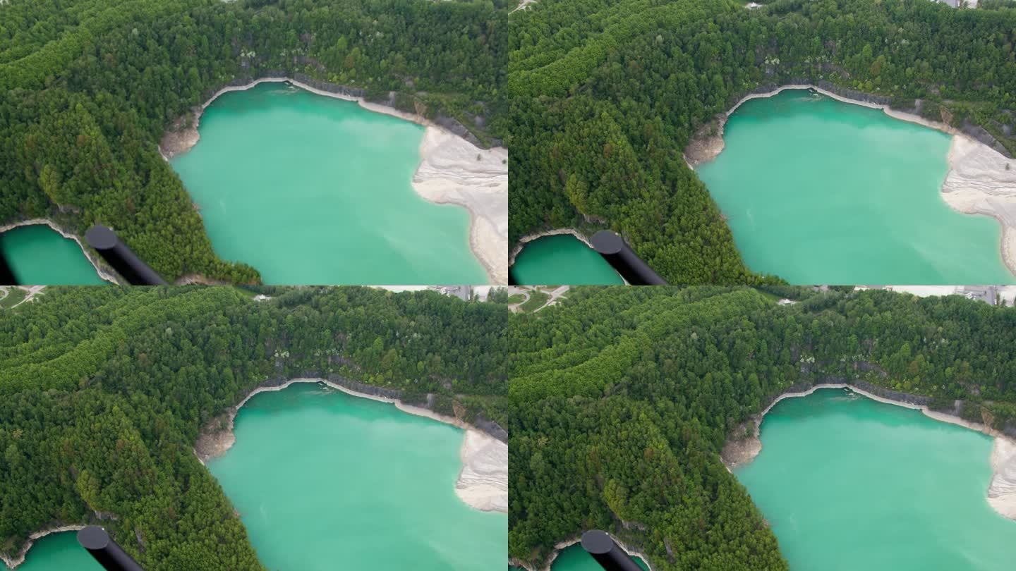 Kalkwerk Flandersbach湖的高分辨率视频，从直升机上拍摄的。它显示了工业区前面的湖