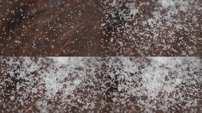 甜菊糖代糖晶体以慢镜头落进一个木碗(特写)。旋转