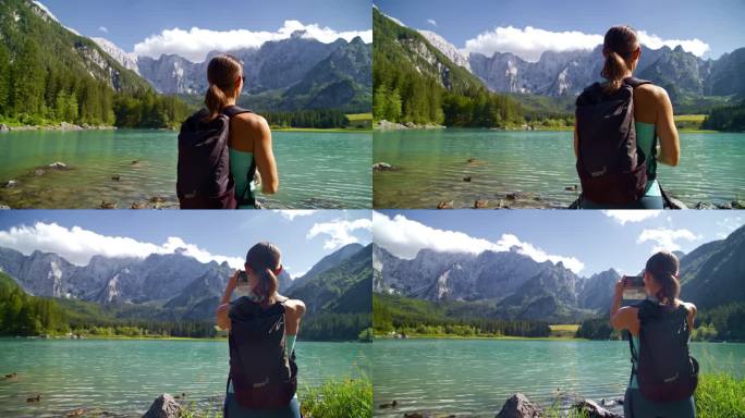 女徒步旅行者拍摄雄伟的山湖景观