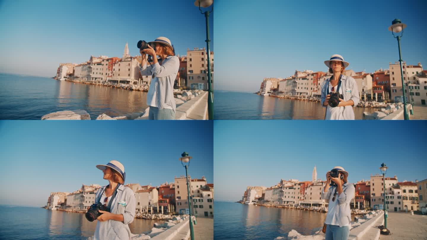 慢镜头捕捉记忆:女人用罗维尼老城作为背景的相机拍摄