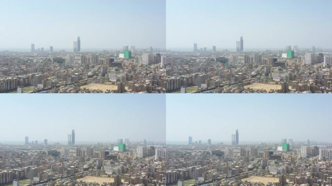 巴基斯坦卡拉奇市天际线的航拍镜头，背景是巴利亚蛋白石塔