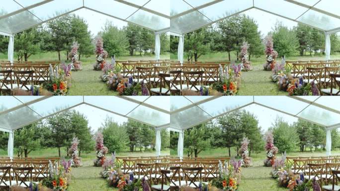 婚礼在公园外的树林里举行。美丽温柔的婚礼花拱和木椅慢动作。