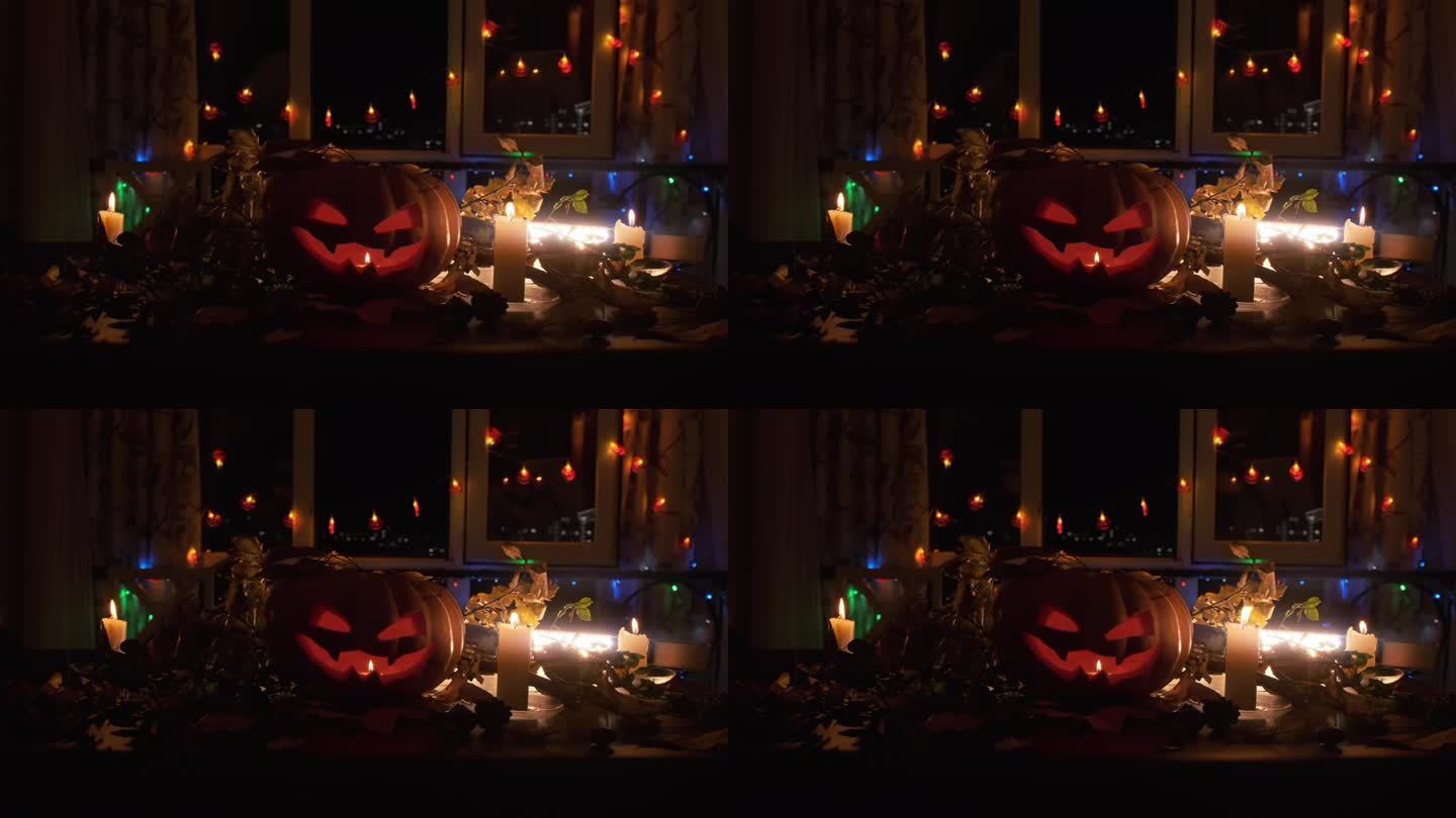 令人毛骨悚然的背景，发光的雕刻传统南瓜形状的南瓜灯旁边的蜡烛