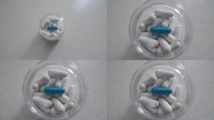 一颗蓝色药丸，孤立背景。药平板电脑。胶囊内瓶。