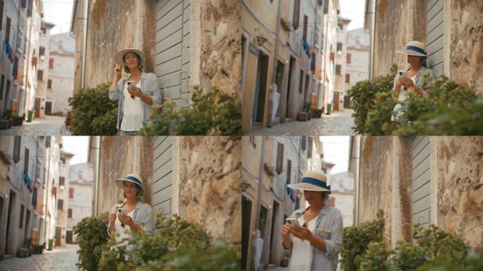 迷人的探索:一个女人揭开隐藏的魅力在罗维尼的鹅卵石小巷与她的智能手机