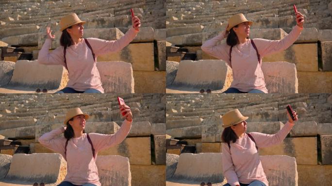 女游客在古希腊剧院自拍。4k画面UHD 3840x2160