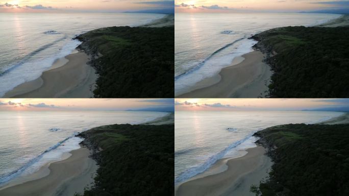 日落时分，墨西哥埃斯孔迪多港的巴科乔海滩上有沙丘和海浪