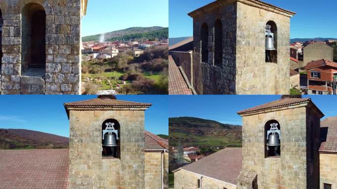 在西班牙卡斯蒂利亚莱昂的一个小镇上，用无人机鸟瞰一座古老教堂的塔楼，上面有铃铛和时钟。