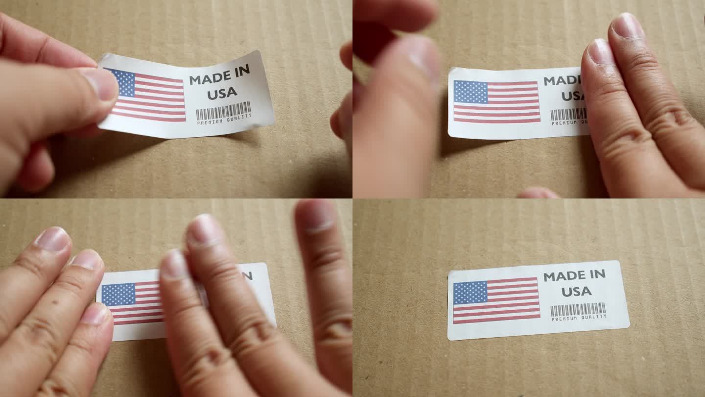 手应用美国制造的旗帜标签上的运输箱与产品优质条码。制造和交付。产品出厂进出口。