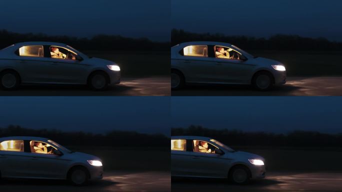 夜间在天空下的路上喝酒开车的年轻女子侧视图