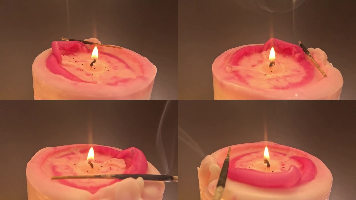 红色的蜡烛在红色的背景下点燃