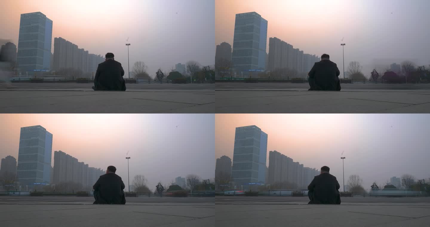 城市男人坐着孤独的背影