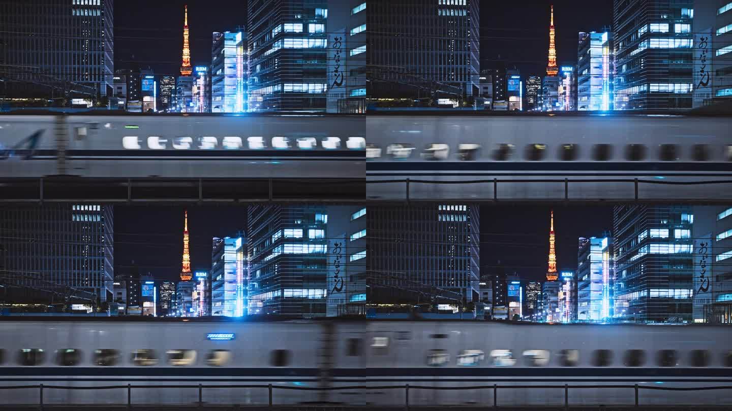 高速快速的新干线列车运输在东京的夜晚，东京塔的城市景观。日本通勤者的生活方式。日本交通系统，亚洲城市