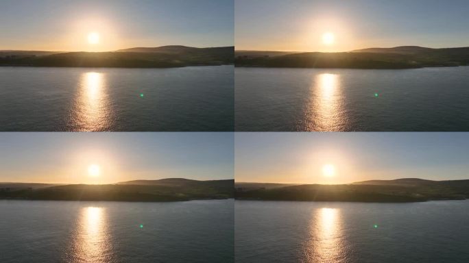 鸟瞰阳光在大海上的安特里姆格兰斯沿着爱尔兰海