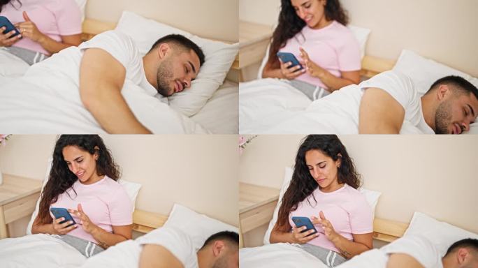 男女情侣玩智能手机，男友在卧室睡觉