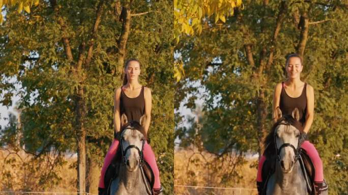 微笑的年轻牧场主在秋天的乡间小路上骑马