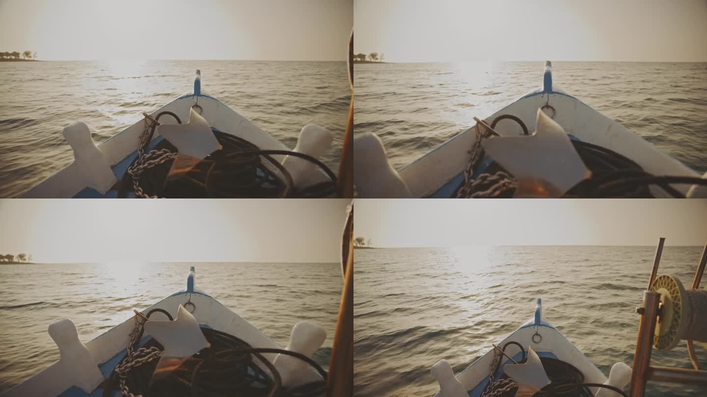 SLO MO驶入日落:一艘老渔船的船头在地平线上
