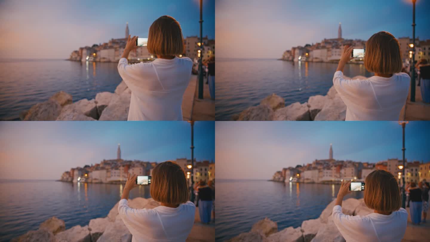 拍摄宁静:日落时分，女人用手机捕捉老城的魅力