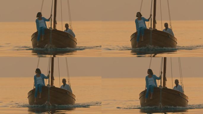 黄昏时分，一对情侣在木船上享受浪漫宁静的旅程