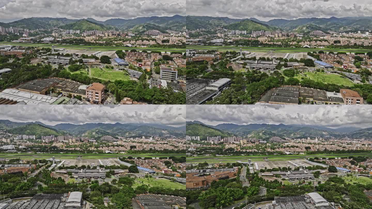 麦德林哥伦比亚空中v16低空立交桥和周围的圣达菲和坎波阿莫瓜亚巴尔捕捉国内机场和城市景观与山区背景-
