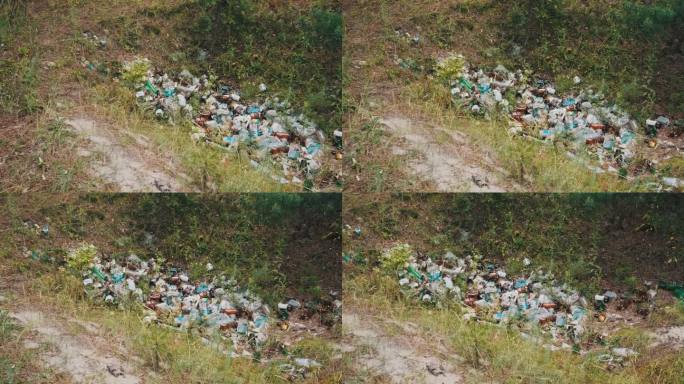 森林坑非法倾倒塑料和瓶子，污染环境