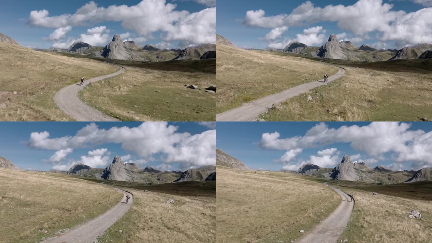 航拍无人机视图骑自行车爬高山口