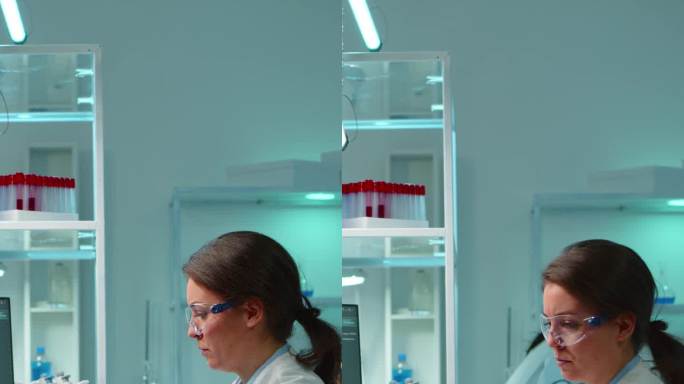 垂直视频:医学实验室工作人员分析血清进行病毒检测