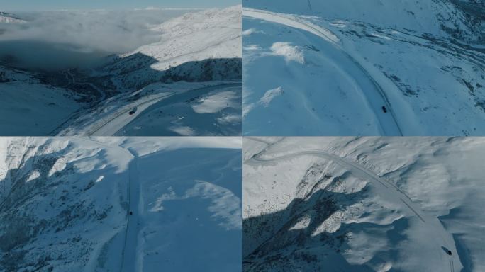 汽车在雪山道路上行驶航拍