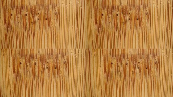 竹制砧板的纹理和纤维，带有刀痕。宏滑块。