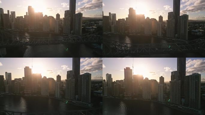 鸟瞰图实时镜头在布里斯班故事桥与拥挤的交通和现代办公大楼在布里斯班河日落时间，布里斯班，昆士兰，澳大