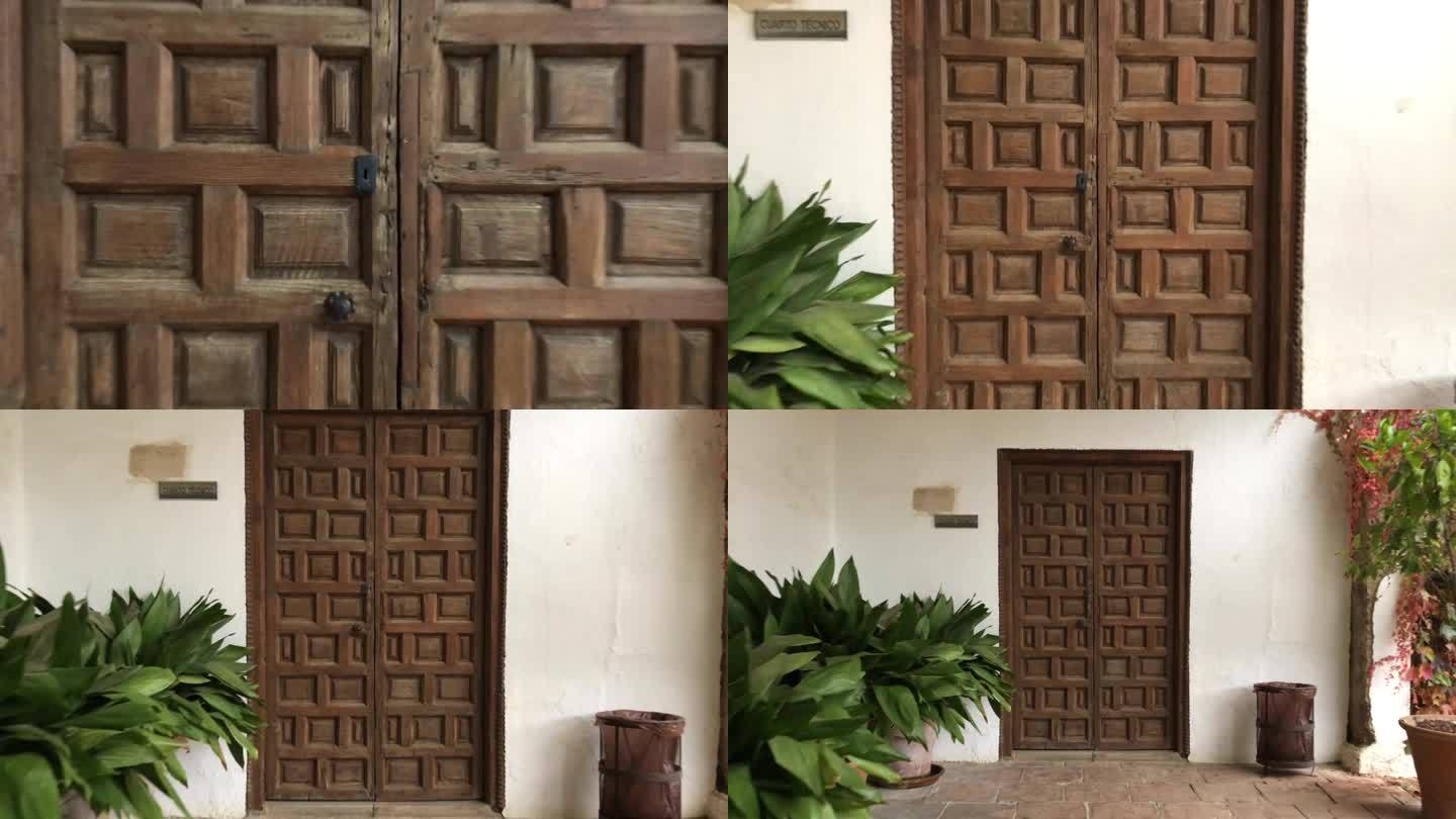 在西班牙格拉纳达的下雨天，在白色的阿尔罕布拉墙上，多利拍出了伊斯兰风格的方形巧克力形状木门