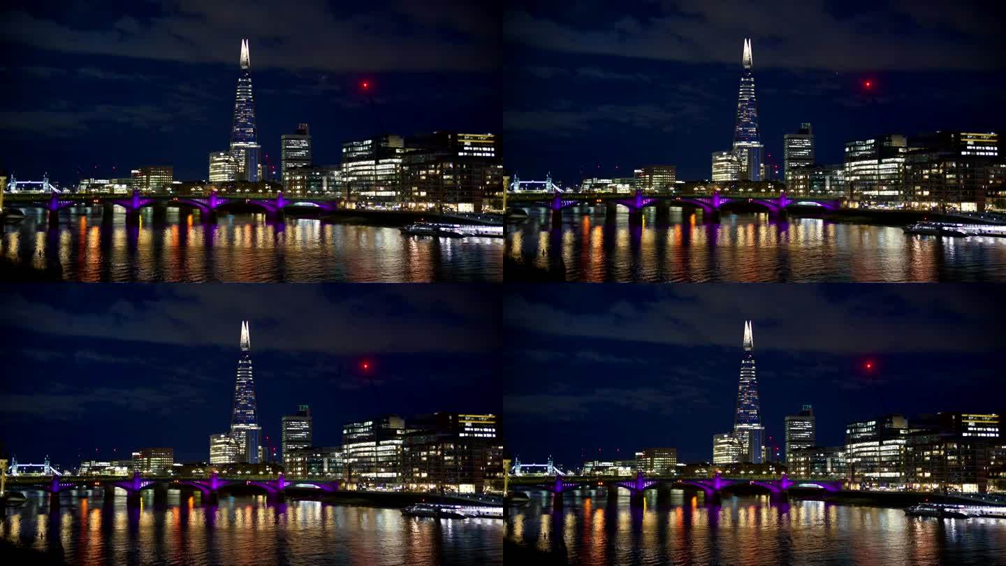 伦敦市中心的夜景，英国。碎片摩天楼等建筑物，泰晤士河上，照明很多