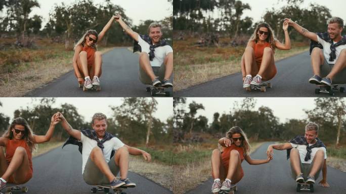 一对夫妇坐在乡村公路上玩滑板，玩得很开心