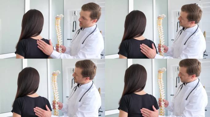 一位年轻女子正在接受脊椎病学专家的检查。一位专业医生检查病人的背部