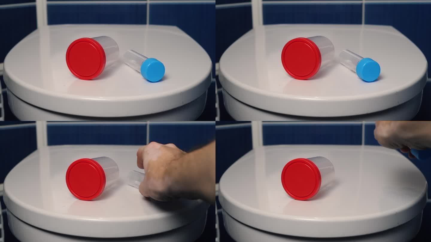 一名男子的手从厕所的马桶盖上取下测试容器。男性保健。医学检验的概念，要健康