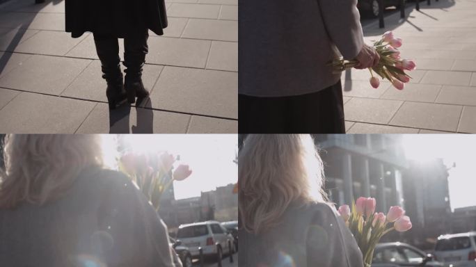 一位优雅的年长女子手捧郁金香走在街上