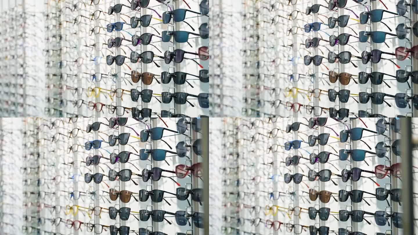 眼镜店的眼镜陈列者，由陈列在眼镜店墙上的一排排时髦的眼镜组成