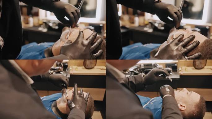 发型师戴着黑色手套，用剃刀给顾客剃胡子的特写
